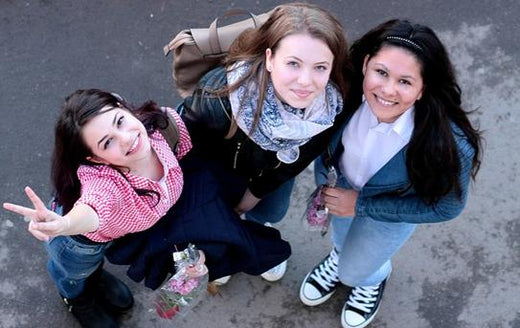 three young women smiling